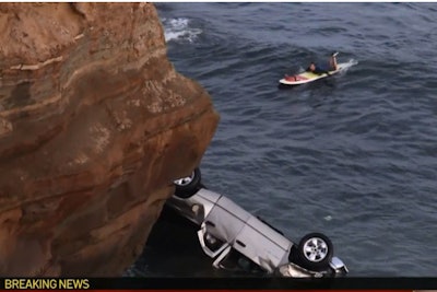 Officer Jonathan Wiese rappelled down a 30-foot cliff with the use of a K-9 leash in order to rescue two toddlers and their father from a truck overturned in the ocean.