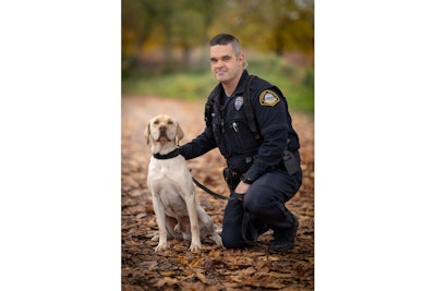 K-9 Sam alongside his handler, Officer Devin Tucker.