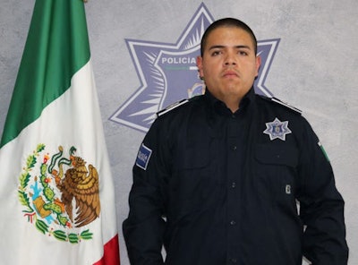 Marco Antonio Guzman Galvan was wearing his police uniform when he was shot by an unknown assailant after leaving his department and driving home.