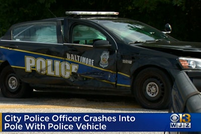 An officer with the Baltimore Police Department—whose name has not been released—crashed into a pole near the district courthouse and suffered minor injuries.