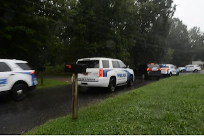 An officer with the Hickory (NC) Police Department who was struck by a car during a vehicle pursuit of an armed robbery suspect was reportedly uninjured during the incident.