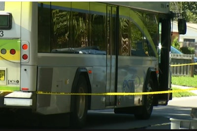 An officer with the Largo (FL) Police Department was struck by a passing bus as he attempted to create distance between himself and a dog that had been charging him in an aggressive manner.