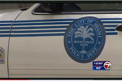 The wife of an officer with the Miami Police Department perished in the back of her husband's squad car on Friday afternoon as the vehicle's temperature rose to dangerous levels and she had no way of getting out.
