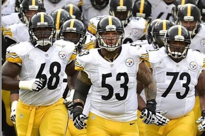 Maurkice Pouncey (at center, wearing uniform number 53) wore a decal on his helmet during Sunday's to honor Officer Eric Kelly, who was killed in the line of duty in 2009.