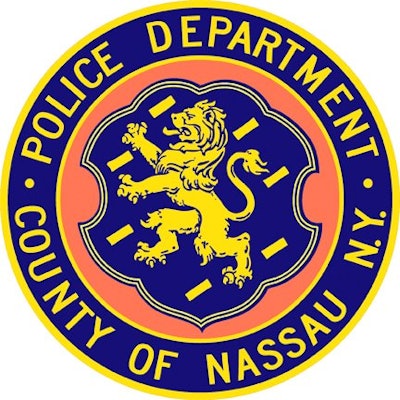 An officer with the Nassau County Police Department who had responded to reports of an injured woman at a local bar was attacked and bitten by a bystander on Saturday night.
