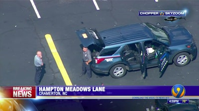 Police in Gaston County, NC, say a suspect was shot by a woman while he was in custody in the back of an SUV. (Photo: WSOC screen shot)