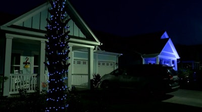 A Myrtle Beach, SC, neighborhood lit up blue Tuesday night to honor the local police and remember slain officer Jacob Hancher. (Photo: WMBF screen shot)