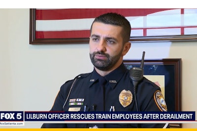 Officer Almedin Ajanovic was finishing an off-duty job early Sunday morning when he heard calls about explosions and a train derailment. He raced to the scene and immediately took action to save the lives of the engineers trapped on top of the toppled train.