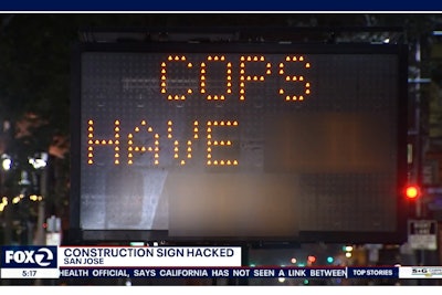 Clever computer hackers in California's Silicon Valley hijacked an electric road sign to display an anti-police message for passing motorists.