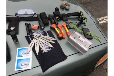 After a Portland officer was pepper sprayed in his patrol vehicle, responding officers say they found these weapons and gear in the suspect's car. (Photo: Portland Police Bureau)