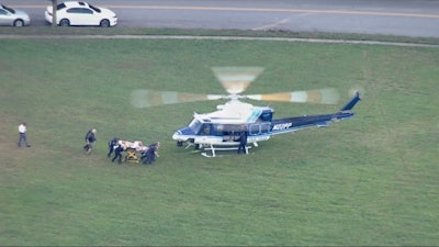 A Montgomery County, MD, police officer was airlifted from the scene after being shot during the attempted arrest of a homicide suspect. (Photo: ABC 7 Screen Shot)