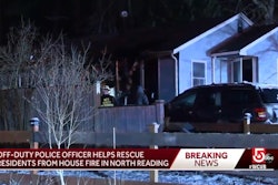 An off-duty North Reading, MA, officer saw this house on fire and had to kick in the door to alert the residents. (Photo: WCVB screen shot)