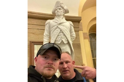 Photo showing Rocky Mount, VA, OfficerJacob Fracker and Sgt. Thomas “T.J.” Robertson inside the U.S. Capitol during the Wednesday Jan. 6 riot. (Photo: Federal Court Exhibit)