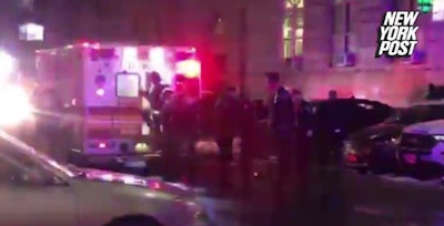 An NYPD officer was seriously injured when a garage door trapped her leg. (Photo: New York Post Video Screen Shot)