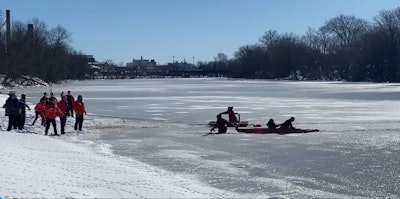 Chief Mike Foligno of the Elmwood Park Police Department and a firefighter used a kayak to pull the mother and toddler off of the river. (Photo: NorthJersey.com Screen Shot)