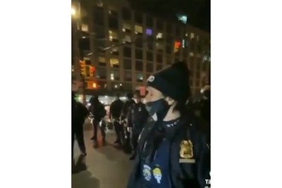 Still from TikTok/Twitter video showing officer wearing political patches during Black Lives Matter demonstration. (Photo: Breaking 911/Twitter)