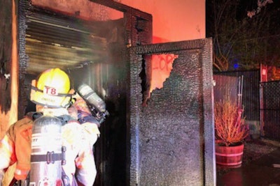 Portland firefighters inspect the damage caused to the police union building Tuesday night. (Photo: Portland Police Bureau)