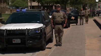 Gov. Greg Abbott asked Texas law enforcement to turn on their red and blue lights for one minute at 1 p.m. on Thursday to honor slain Trooper Chad Walker. (Photo: KXAN Screen Shot)