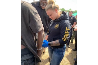 Chester County Sheriff's Deputy Sydney Canipe puts the cuffs on murder suspect Tyler Terry. Officials say that in an earlier vehicle pursuit, the suspect tried to kill her. (Photo: Chester County SO)