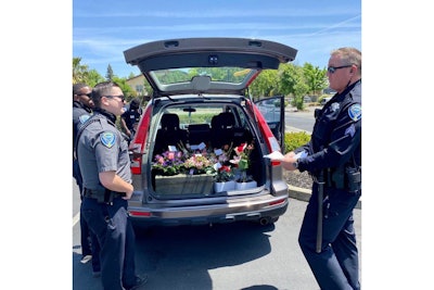 After arresting a delivery for DUI on Mother's Day, officers from the Fairfield (CA) Police Department made sure the flowers got to their intended recipients. (Photo: Fairfield PD/Facebook)