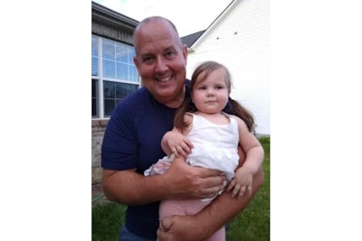 Officer Brian Wilson with 2-year-old Carmella. The little girl nearly drowned and the off-duty officer gave her CPR to get her breathing again.