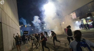 Gas is deployed by Charlotte-Mecklenburg officers during a June 2 protest. The response has triggered two lawsuits. (Photo: Charlotte Observer Screen Shot)