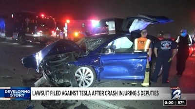 Five law enforcement officers were injured in this crash involving a Tesla. Their attorneys say the driver was DUI and using Autopilot. (Photo: Click2Houston screen shot)