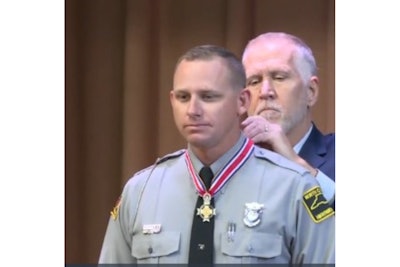 North Carolina Highway Patrol Trooper Daniel Harrell received the Congressional Badge of Bravery from Sen. Thom Tillis. (Photo: WRAL Screen Shot)