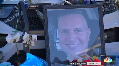 Part of the memorial for Mesquite, TX, Officer Richard Lee Houston II who was slain Friday responding to a disturbance at a grocery store. (Photo: NBCDFW screen shot)