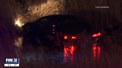 Officer Darrell Shaffer rescued a three-year-old and an eight-month-old from this vehicle after it drove into a retention pond during a pursuit. (Photo: Fox 32 Screen Shot)