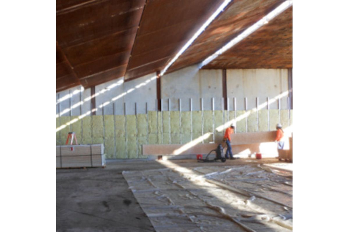 Installing the Troy Acoustics system to the walls of a range. The system absorbs noise and reduces the time that the sound of gunfire reflects on the range down to 1.5 seconds.