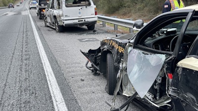 A Florida trooper was injured when his patrol car was hit by a truck Monday. (Photo: FHP)