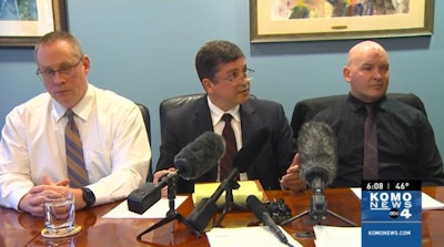 Whatcom County Sheriff's deputies Jason Thompson (left) and Ryan Rathbun (right) meet with the press about their lawsuit filed by attorney Daniel Horne (center). (Photo: KOMO News screen shot)