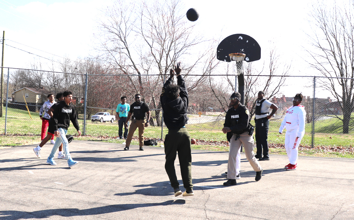Clarksville Police Department (TN) Juvenile Engagement Team officers play basketball with local teens. (Photo: Clarksville PD)