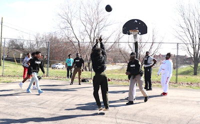 Clarksville Police Department (TN) Juvenile Engagement Team officers play basketball with local teens. (Photo: Clarksville PD)