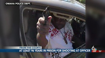 Still from Omaha Police video shows John Ezell Jr. pointing a gun at Officer Ken Fortune in September 2018. (Photo: WOWT screen shot/Omaha PD video)