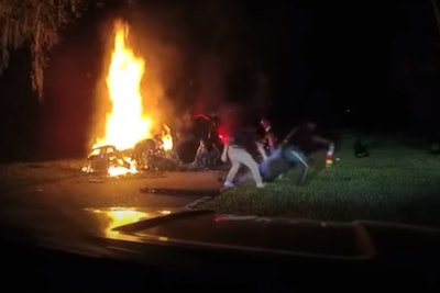 Deputies Garrett Parrish and DFC Bryant Ovalles Vasquez of the Charlotte County (FL) Sheriff's Office recently came upon the scene of a vehicle fire and are now credited with saving the life of a man trapped inside.