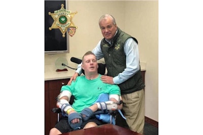 East Baton Rouge Parish Sheriff Sid Gautreaux visits with Deputy Nick Tullier, who was critically wounded in a 2016 ambush attack that killed three other law enforcement officers and has now killed Tullier. (Photo: East Baton Rouge Parish SO/Facebook)