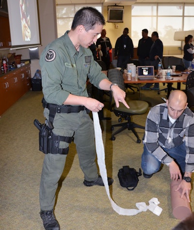 Dr. Joe Nakagawa, medical director for the Hathorne Police Department, leads a medical training session for officers.