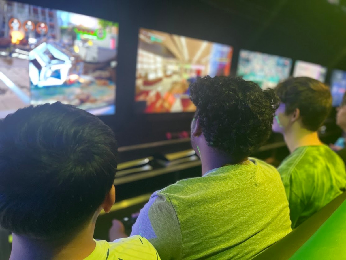 Young people play video games inside the Orange County Sheriff’s Office Mobile Video Game Theater.