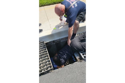 Montgomery County Police officer H. Chen rescued ducklings from a local storm drain with the aid of firefighters. (Photo: Montgomery County PD)
