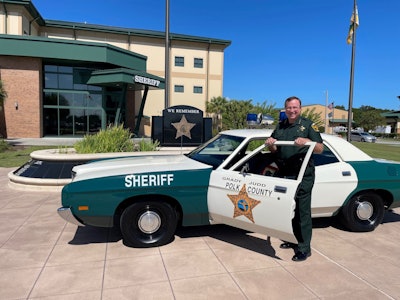 Polk County Sheriff Grady Judd is shown with the department’s fully restored 1972 Ford Galaxie. The department was given the car, in civilian form, in 2014 and restoration was completed in time to recognize the sheriff’s being with the department 50 years in July.