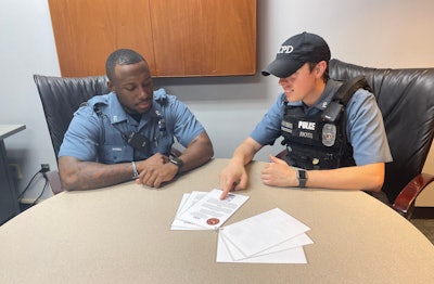 Officer Blake Ross, a field training officer for the Kansas City Police Department, coaches Officer Michael Words, left, on some of the techniques of the Tactical Longevity program.