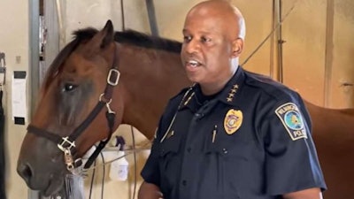 Wilmington, NC, Police Chief Donnie Williams with police horse Elton. The horse is recovering from being hit by a vehicle Friday. (Photo: Wilmington PD/Facebook)