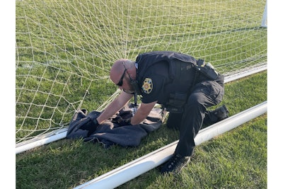 Douglas County, CO, Sheriff's Deputy Koski was called to the soccer field at Ponderosa High School to rescue a fox trapped in a net. (Photos: Douglas County SO/Facebook)