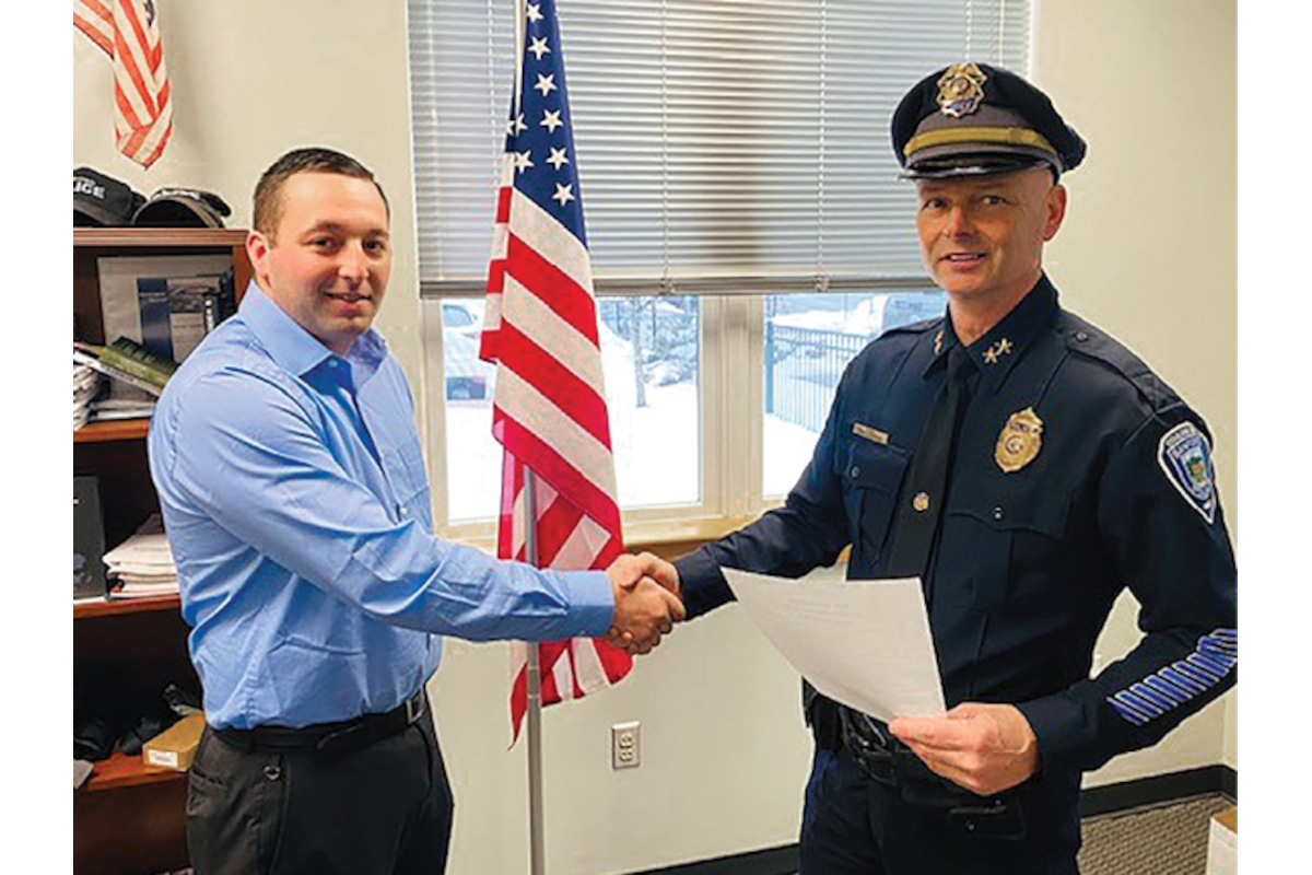 Sanford, ME, Police Chief Craig Andersen swears in a new officer. Andersen is an advocate of decentralized command that he says empowers his troops. (Photo: Sanford PD)