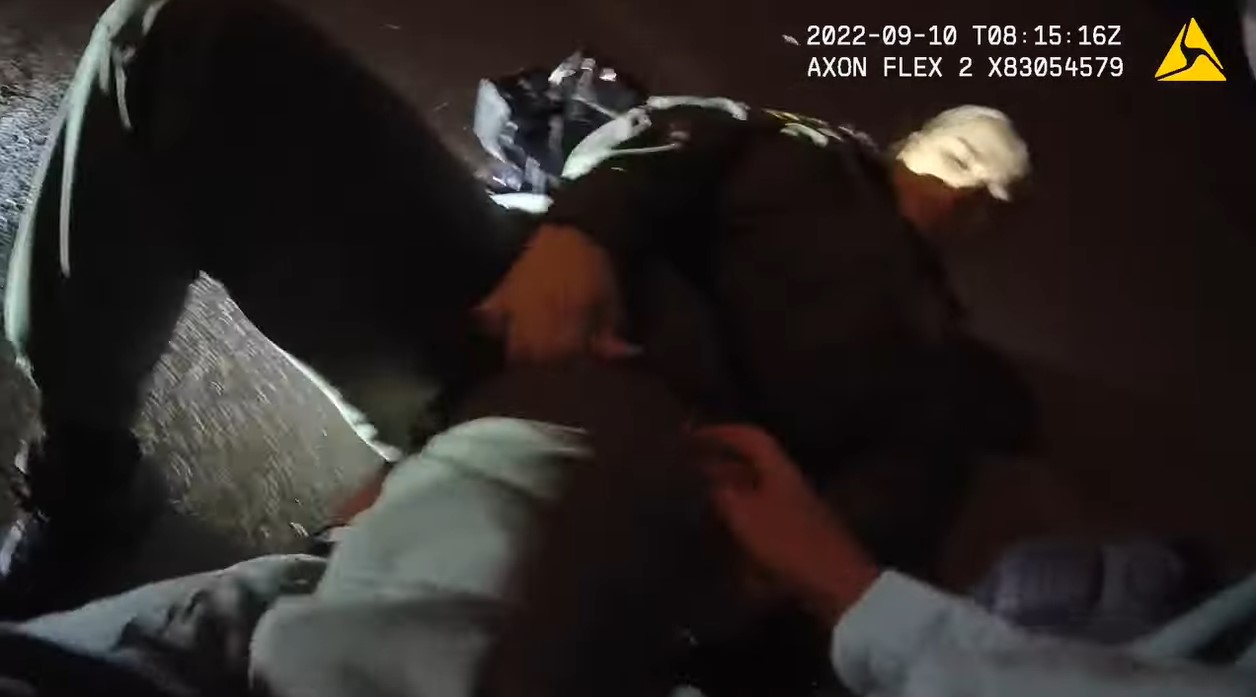 Still from body camera video shows officer applying tourniquet to Officer Tierney Tomburo's leg. (Photo: Las Vegas Metro PD)