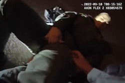 Still from body camera video shows officer applying tourniquet to Officer Tierney Tomburo's leg. (Photo: Las Vegas Metro PD)