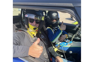 Monroe County Sheriff Todd Baxter takes a few laps with a driving instructor at Watkins Glen International.