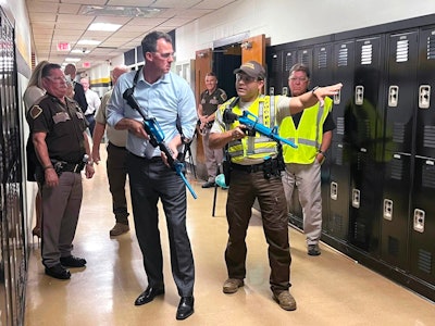 Oklahoma Gov. Kevin Hitt joins state troopers during active shooter response training that was mandated by his executive order in June. All troopers will complete the course by the end of the year.
